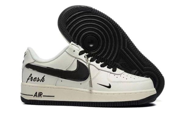 White and black Nike Air Force 1 Low custom sneakers with “Fresh” text and black outsole.