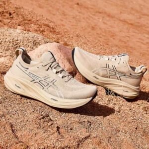 Side view of beige ASICS Gel-Excite LiteTrail shoes placed on rocky terrain