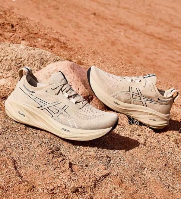 Side view of beige ASICS Gel-Excite LiteTrail shoes placed on rocky terrain